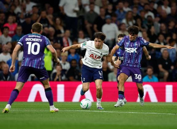 Mikey Moore of Tottenham Hotspur takes on Rob Apter (30) and Greg Docherty (10) of Charlton Athletic Tottenham Hotspur v Charlton Athletic, EFL Carabao Cup, Second Round, Football, Tottenham Hotspur Stadium, London, UK - 26 Aug 2026London Tottenham Hotspur Stadium United Kingdom EDITORIAL USE ONLY No use with unauthorised audio, video, data, fixture lists, club league logos or live services. Online in-match use limited to 120 images, no video emulation. No use in betting, games or single club league player publications. Copyright: xMattxImpey Shutterstockx 17115050as