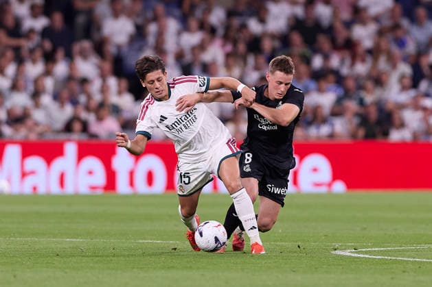 ESP: LaLiga EA Sports Real Madrid v Real Sociedad Arda Guler of Real Madrid battles for possession with Benat Turrientes of Real Sociedadduring LaLiga EA Sports match between Real Madrid v Real Sociedad played at Bernabeu Stadium, Madrid on August 26 2026 in Spain Madrid Spain Soccer Copyright: xAgenciaxLOFx
