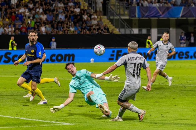 Zan-Luk Leban of Celje and Cristian Martinez of SK Slovan Bratislava seen during UEFA Champions league second leg play-off game between teams of SK Slovan Bratislava and Celje (Dominika Kortvelyesiova Ball Raw Images) Celje Stadion Celje Slovenia Copyright: xDominikaxKortvelyesiovax DKOR4074