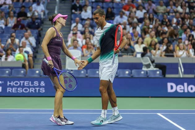 2026 US Open Mixed Doubles Championship semifinals Belinda Bencic (L) of Switzerland and Flavio Cobolli (R) of Italy react during the semifinal round of the Mixed Doubles Championship against Elina Svitolina of Ukraine and Gael Monfils of France at the Arthur Ashe Stadium in the USTA Billie Jean King National Tennis Center in Flushing Meadows, New York, USA, 26 August 2026. FLUSHING MEADOWS NEW YORK UNITED STATES  Copyright: xSARAHxYENESELx