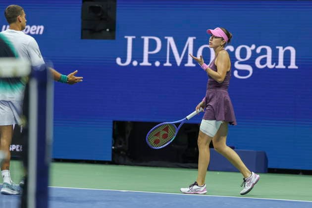 2026 US Open Mixed Doubles Championship semifinals Belinda Bencic (R) of Switzerland reacts while playing with Flavio Cobolli (L) of Italy during the semifinal round of the Mixed Doubles Championship against Elina Svitolina of Ukraine and Gael Monfils of France at the Arthur Ashe Stadium in the USTA Billie Jean King National Tennis Center in Flushing Meadows, New York, USA, 26 August 2026. FLUSHING MEADOWS NEW YORK UNITED STATES  Copyright: xSARAHxYENESELx