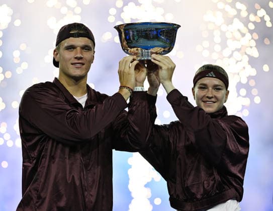 Karolína Muchová Jakub Menöík pose with the Championship Trophy after defeating Belinda Bencic Flavio Cobolli, 6-3, 1-6, 10-6 in Arthur Ashe Stadium on the Tuesday before the 2026 US Open Tennis Championship at the USTA Billie Jean King National Tennis Center in New York City on Tuesday, August 26, 2026.  NYP20260826305 LARRYxMARANO