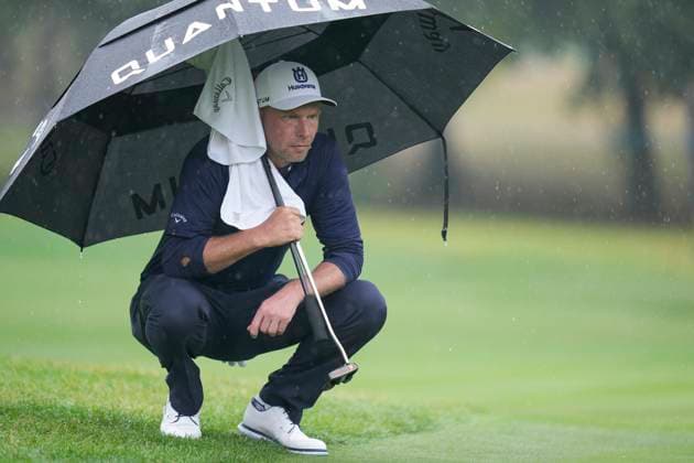 SUTTON COLDFIELD, ENGLAND - AUG 27: Marcel Siem (GER) shelters under an umbrella on the first green during Round 1 at the 2026 Husqvarna British Masters at The Belfry, Sutton Coalfield on August 27, 2026 in Warwickshire, England The 2026 Husqvarna British Masters