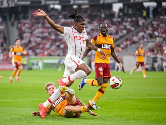 Ewan Wilson (Motherwell FC) and Cyriaque IriÃ (SC Freiburg) battle for the ball during the UEFA Conference League 2026 27 Play Off Round Second Leg match between Club Freiburg and Motherwell at Stadion am Wolfswinkel on August 27, 2026 in Freiburg, Germany. (Photo by Harry Langer DeFodi Images) -