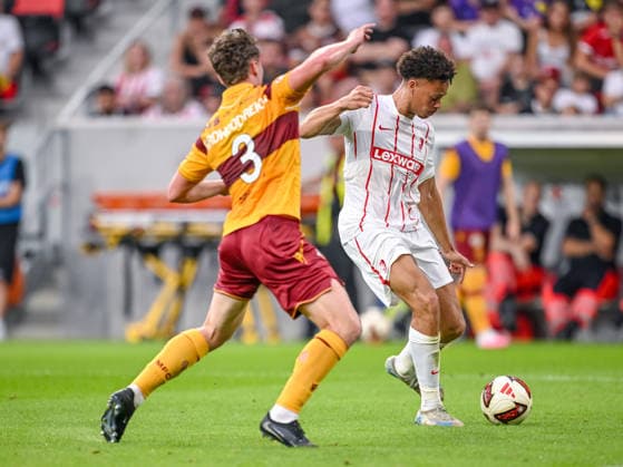 Jake Girdwood-Reich (Motherwell FC) and Derry Scherhant (SC Freiburg) battle for the ball during the UEFA Conference League 2026 27 Play Off Round Second Leg match between Club Freiburg and Motherwell at Stadion am Wolfswinkel on August 27, 2026 in Freiburg, Germany. (Photo by Harry Langer DeFodi Images) -