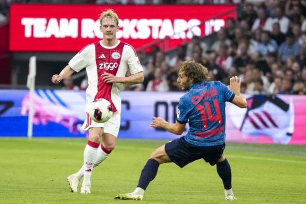 AMSTERDAM , 27-08-2026 , JohanCruijff ArenA , season 2026 2027 , UEFA Conference League play-off football . Match between Ajax and FC Sion, Picture shows Ajax player Julian Brandt and FC Sion player Numa Lavanchy Ajax - Sion  x206096579x Copyright: