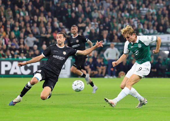 Hibernian v K.A.A. Gent UEFA Europa Conference League Nathan Lowe of Hibernian (right) shoots under pressure from Christian Burgess of K.A.A. Gent during the UEFA Europa Conference League Play-Off Second Leg match at Easter Road, Edinburgh 27 08 2026 UK Newspapers OUT Copyright: xFredxPalmerx FIL-23844-0043