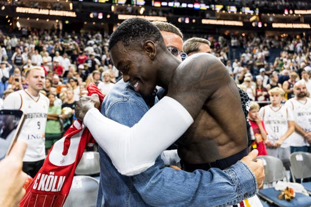 COLOGNE, GERMANY - AUGUST 27: Said El Mala (1. FC Koeln) and Dennis Schroeder (Schröder, Schroder, Germany, 17) hug after a FIBA World Cup European Qualifiers match between Germany vs. Netherlands at Lanxess arena on August 27, 2026 in Cologne, Germany. North Rhine Westphalia Germany Copyright: xSteffiexWunderlx