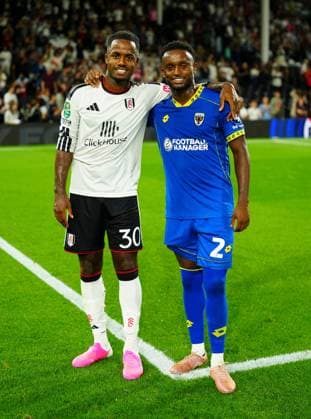 Ryan Sessegnon of Fulham and Steven Sessegnon of AFC Wimbledon pose together at full time Fulham v AFC Wimbledon, EFL Carabao Cup, Second Round, Football, Craven Cottage, London, UK - 27 Aug 2026London Craven Cottage United Kingdom EDITORIAL USE ONLY No use with unauthorised audio, video, data, fixture lists, club league logos or live services. Online in-match use limited to 120 images, no video emulation. No use in betting, games or single club league player publications. Copyright: xJavierxGarcia Shutterstockx 17118946bb