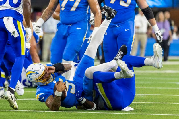 August 27, 2026, Inglewood, California, USA: Los Angeles Chargers Outside Linebacker Trey Lance (5) is brought down by Los Angeles Rams Defensive End Braden Fiske (55) during an NFL, American Football Herren, USA football preseason game, in Inglewood, Calif. on Thursday August 27, 2026. Inglewood USA - ZUMAc68_ 20260827_zaf_c68_003 Copyright: xRingoxChiux