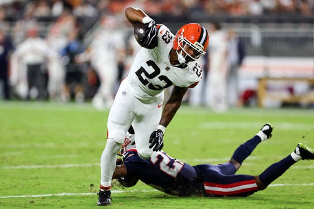 CLEVELAND, OH - AUGUST 27: Cleveland Browns running back Ahmani Marshall (23) eludes the tackle attempt of New England Patriots cornerback Charles Woods (22) during the first quarter of the National Football League preseason game between the New England Patriots and Cleveland Browns on August 27, 2026, at Huntington Bank Field in Cleveland, OH. (Photo by Frank Jansky Icon Sportswire) NFL, American Football Herren, USA AUG 27 Patriots at Browns EDITORIAL USE ONLY Icon260827020