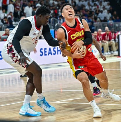 Qatar v China - FIBA Basketball World Cup 2027 Asian Qualifiers Xining He (R) of China and Ndoye Seydou (L) of Qatar in action during the second-round match between China and Qatar in the FIBA Basketball World Cup Asian Qualifiers at Al Janoub Stadium in Al Wakrah, Qatar, August 27, 2026. DOHA Qatar Copyright: xNOUSHADx