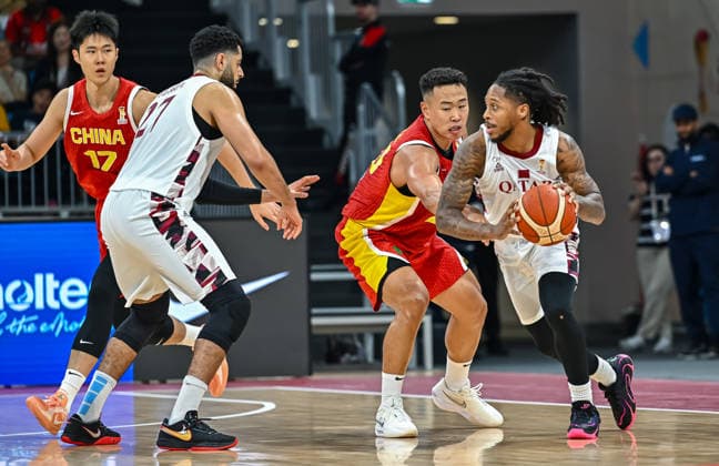 Qatar v China - FIBA Basketball World Cup 2027 Asian Qualifiers He Xining (2-R) of China and Lewis II Mike (R) of Qatar in action during the second-round match between China and Qatar in the FIBA Basketball World Cup Asian Qualifiers at Al Janoub Stadium in Al Wakrah, Qatar, August 27, 2026. DOHA Qatar Copyright: xNOUSHADx