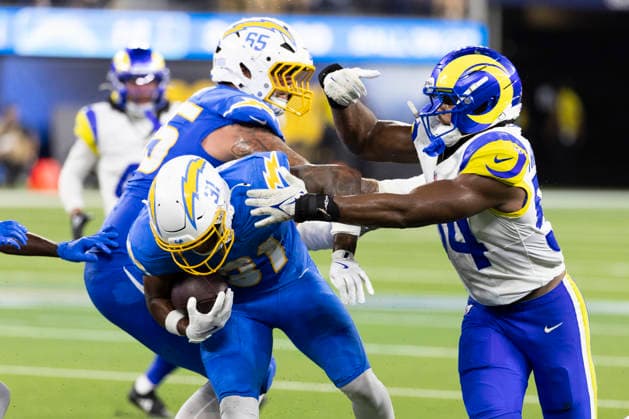 August 27, 2026, Inglewood, California, USA: Los Angeles Chargers Running Back Gregory Desrosiers (31) escapes a tackle-attempt by Los Angeles Rams Inside Linebacker Nikhai Hill-Green (54) during an NFL, American Football Herren, USA football preseason game, in Inglewood, Calif. on Thursday August 27, 2026. NHL, Eishockey Herren, USA 2026: LA Rams 20:18 LA Chargers  - ZUMAc68_ 20260827_zaf_c68_026 Copyright: xRingoxChiux