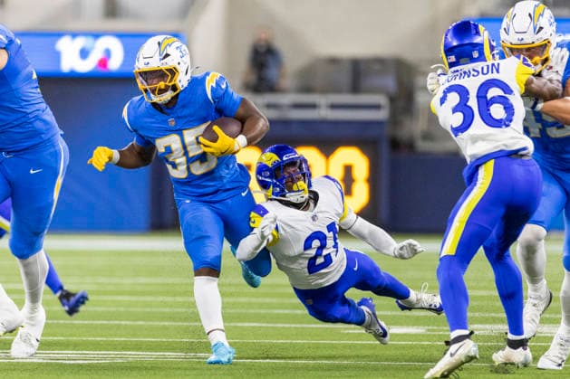 August 27, 2026, Inglewood, California, USA: Los Angeles Chargers Running Back Amar Johnson (35) escapes a tackle-attempt by Los Angeles Rams Cornerback Cam Lampkin (21) during an NFL, American Football Herren, USA football preseason game, in Inglewood, Calif. on Thursday August 27, 2026. NHL, Eishockey Herren, USA 2026: LA Rams 20:18 LA Chargers - ZUMAc68_ 20260827_zaf_c68_050 Copyright: xRingoxChiux