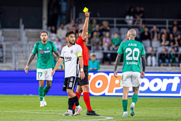 UEFA Europa League play-offs, 2nd leg – Kauno Žalgiris vs Besiktas at Dariaus ir Gireno Stadium, Kaunas, Lithuania. Anthony Kalik receives a yellow card during the UEFA Europa League play-offs second leg match between Kauno Zalgiris and Besiktas at Dariaus ir Gireno Stadium in Kaunas, Lithuania. Kaunas Kaunas Lithuania