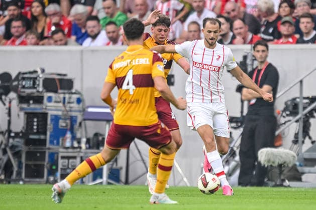 Jamie Knight-Lebel (Motherwell FC), Seb Palmer-Houlden (Motherwell FC) and Max Rosenfelder (SC Freiburg) battle for the ball during the UEFA Conference League 2026 27 Play Off Round Second Leg match between Club Freiburg and Motherwell at Stadion am Wolfswinkel on August 27, 2026 in Freiburg, Germany. (Photo by Harry Langer DeFodi Images) -