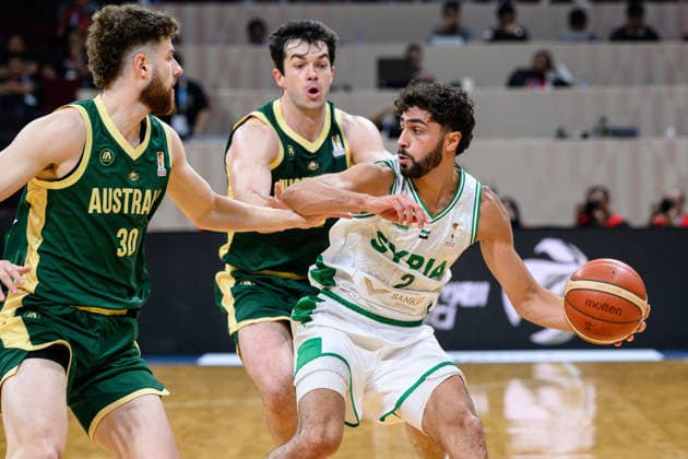 August 28, 2026, Manilla, Manila, Philippines: Australia s Anthony DELLORSO (L) with Australia s Josh BANNAN (M) stays on Syrias Omar IDLBI.Australia vs Syria in their Group E match of the FIBA Basketball World Cup Qualifiers at the Mall of Asia Arena, Manila, Philippines on Friday 28 August 2026. FIBA World Cup Basketball Asian Qualifiers  - ZUMAr144 20260828_zap_r144_012 Copyright: xJaynexRussellx