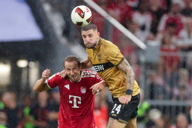Harry Kane (FC Bayern Muenchen) und Jeff Chabot (VfB Stuttgart) kaempfen um den Ball waehrend des Spiels der 1. Bundesliga zwischen FC Bayern Muenchen und VfB Stuttgart, Allianz Arena am 28. August 2026 in Muenchen, Deutschland. (Foto von Marco Steinbrenner DeFodi Images) +++ Harry Kane (FC Bayern Muenchen) und Jeff Chabot (VfB Stuttgart) battle for the ball during the Bundesliga match between FC Bayern Muenchen and VfB Stuttgart at Allianz Arena on August 28, 2026 in Munich, Germany. (Photo by Marco Steinbrenner DeFodi Images) DFB DFL REGULATIONS PROHIBIT ANY USE OF PHOTOGRAPHS AS IMAGE SEQUENCES AND OR QUASI-VIDEO. (Photo by Marco Steinbrenner DeFodi Images) - *** Harry Kane of FC Bayern Munich and Jeff Chabot of VfB Stuttgart battle for the ball during the Bundesliga match between FC Bayern Munich and VfB Stuttgart, Allianz Arena on August 28, 2026, in Munich, Germany. Photo by Marco Steinbrenner, DeFodi Images. Harry Kane of FC Bayern Munich and Jeff Chabot of VfB Stuttgart battle for the ball during the Bundesliga match between FC Bayern Munich and VfB Stuttgart at Allianz Arena on August 28, 2026 in Munich, Germany. Photo by Marco Steinbrenner, DeFodi Images. DFB and DFL regulations prohibit any use of photographs as image sequences and or quasi-video. Photo by Marco Steinbrenner, DeFodi Images.