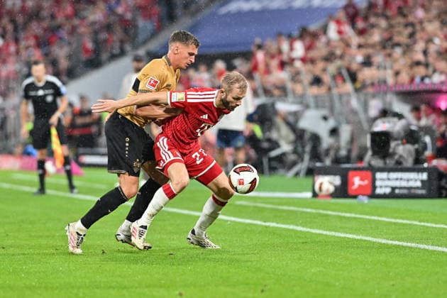 MUNICH, GERMANY - 28. AUGUST: tackle between Grischa PROEMEL (VfB Stuttgart 21) and Konrad LAIMER (FC Bayern Munich 27) during the Bundesliga Match between FC Bayern Munich vs. VfB Stuttgart at Matchday 1 at Allianz Arena DFL REGULATIONS PROHIBIT ANY USE OF PHOTOGRAPHS AS IMAGE SEQUENCES AND OR QUASI-VIDEO Copyright: xBEAUTIFULxSPORTS Goldbergx