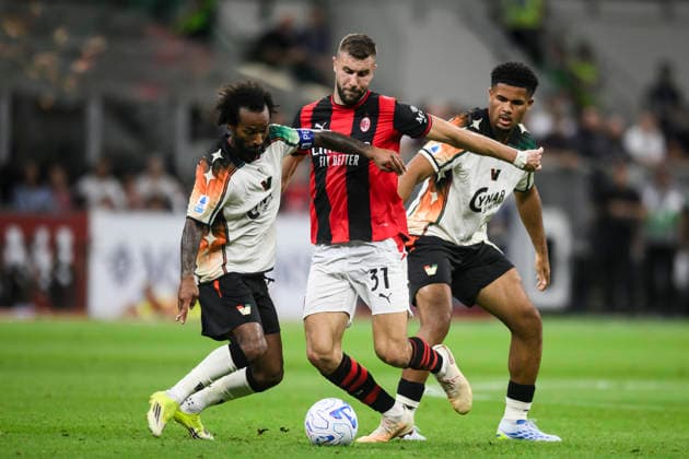 AC Milan v Venezia FC - Serie A Strahinja Pavlovic of AC Milan comeptes for the ball with Gianluca Busio and Simon Sohm of Venezia FC during the Serie A football match between AC Milan and Venezia FC. Milan Italy Copyright: xNicolòxCampox