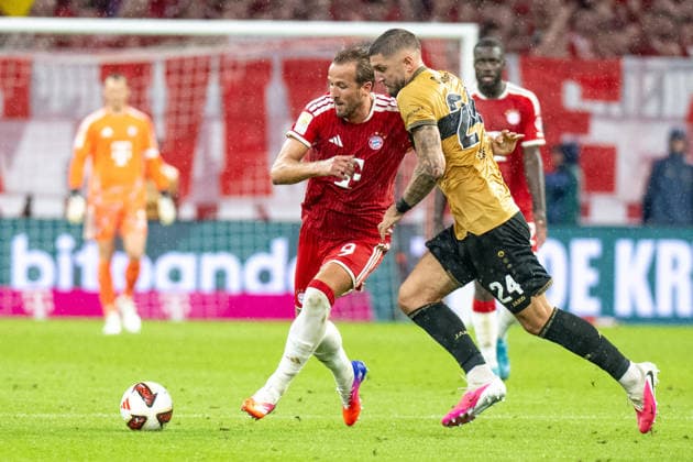 Harry Kane 9 (FC Bayern Muenchen) wird attakiert von Jeff Chabot 24 (VfB Stuttgart), FC Bayern Muenchen - VfB Stuttgart, Fussball Bundesliga, 1. Spieltag, 28.08.2026 DFB regulations prohibit any use of photographs as image sequences and or quasi-video Muenchen Bayern Deutschland *** Harry Kane 9 (FC Bayern Munich) is tackled by Jeff Chabot 24 (VfB Stuttgart), FC Bayern Munich vs. VfB Stuttgart, Bundesliga soccer, Matchday 1, August 28, 2026. DFB regulations prohibit any use of photographs as image sequences and or quasi-video. Munich, Bayern, Germany Copyright: xkolbert-press UlrichxGamelx