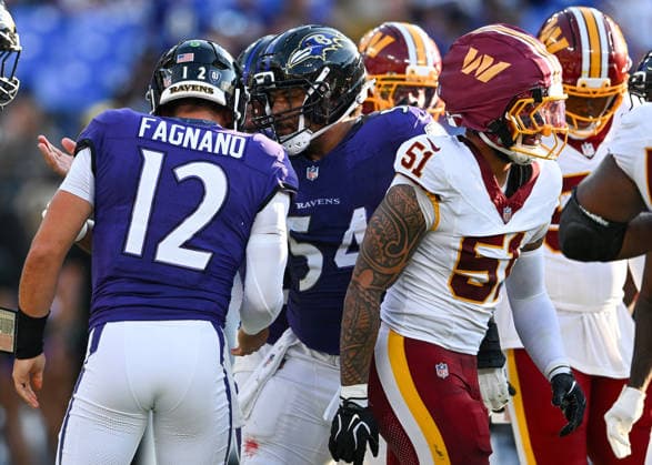 Baltimore Ravens quarterback Joe Fagnano (12) is congratulated after scoring a one yard touchdown against the Washington Commanders during the first quarter of a preseason game at M&T Bank Stadium in Baltimore, Maryland, on Friday, August 28, 2026.  BAL20260828114 DAVIDxTULIS