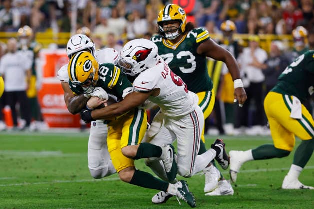 GREEN BAY, WI - AUGUST 28: Green Bay Packers quarterback Kyle McCord (18) is sacked during a preseason game between the Green Bay Packers and the Arizona Cardinals on August 28, 2026 at Lambeau Field, in Green Bay, WI. (Photo by Larry Radloff Icon Sportswire) NFL, American Football Herren, USA AUG 28 Cardinals at Packers EDITORIAL USE ONLY Icon202608282213