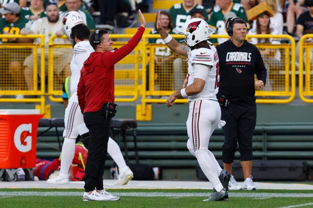 GREEN BAY, WI - AUGUST 28: Arizona Cardinals head coach Mike LaFluer high fives Arizona Cardinals quarterback Gardner Minshew (15) prior to a preseason game between the Green Bay Packers and the Arizona Cardinals on August 28, 2026 at Lambeau Field, in Green Bay, WI. (Photo by Larry Radloff Icon Sportswire) NFL, American Football Herren, USA AUG 28 Cardinals at Packers EDITORIAL USE ONLY Icon202608280292