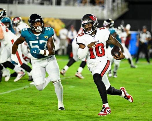 Tampa Bay Quarterback Jalon Daniels scrambles for short yardage in the first quarter as the Buccaneers compete against the Jaguars at EverBank Stadium in Jacksonville, Florida on Friday August 28, 2026. The Jaguars defeated the Bucs 19-0.  JAX20260828004 JOExMARINO