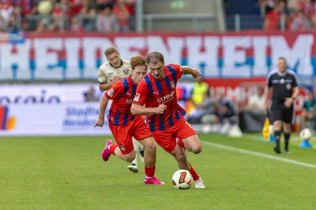 Dynamische Ballfuehrung Budu Zivzivadze (1.FC Heidenheim, 11) dahinter Michael Heule (1.FC Heidenheim, 27), GER, 1.FC Heidenheim vs. SG Dynamo Dresden, Fussball, 2. Bundesliga, 03. Spieltag, Spielzeit 2026 2027, 29.08.2026, DFL DFB REGULATIONS PROHIBIT ANY USE OF PHOTOGRAPHS AS IMAGE SEQUENCES AND OR QUASI-VIDEO, GER, 1.FC Heidenheim vs. SG Dynamo Dresden, Fussball, 2. Bundesliga, 03. Spieltag, Spielzeit 2026 2027, 29.08.2026 Heidenheim *** Dynamic Ball Control: Budu Zivzivadze, 1 FC Heidenheim, 11; behind him, Michael Heule, 1 FC Heidenheim, 27, GER, 1 FC Heidenheim vs. SG Dynamo Dresden, Soccer, 2. Bundesliga, Matchday 3, 2026–2027 season, August 29, 2026, DFL and DFB regulations prohibit any use of photographs as image sequences and or quasi-video, GER, 1 FC Heidenheim vs. SG Dynamo Dresden, Soccer, 2. Bundesliga, Matchday 3, 2026–2027 season, August 29, 2026, Heidenheim Copyright: xEibner-Pressefoto JanixPlessx EP_JPL