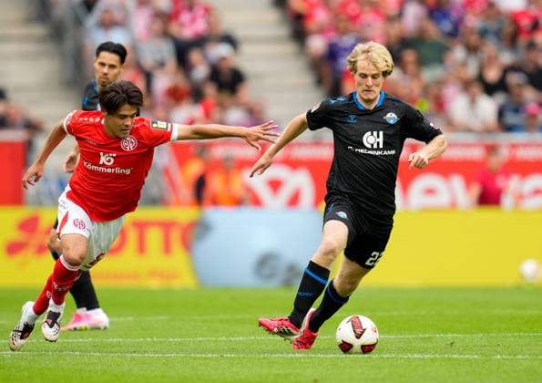Kaishu Sano (1. FSV Mainz 05, 6) gegen Mattes Hansen (SC Paderborn 07, 22). GER, 1. FSV Mainz 05 vs SC Paderborn 07, 1. Bundesliga, 1. Spieltag, Saison 2026-27, MEWA-Arena, Mainz, 29.08.2026 DFL REGULATIONS PROHIBIT ANY USE OF PHOTOGRAPHS AS IMAGE SEQUENCES AND OR QUASI-VIDEO GER, 1. FSV Mainz 05 vs SC Paderborn 07, 1. Bundesliga, 1. Spieltag, Saison 2026-27, 29.08.2026 Mainz *** Kaishu Sano 1 FSV Mainz 05, 6 vs. Mattes Hansen SC Paderborn 07, 22 GER, 1 FSV Mainz 05 vs. SC Paderborn 07, 1 Bundesliga, Matchday 1, 2026–27 season, MEWA Arena, Mainz, August 29, 2026 DFL regulations prohibit any use of photographs as image sequences and or quasi-video GER, 1 FSV Mainz 05 vs. SC Paderborn 07, 1 Bundesliga, Matchday 1, 2026–27 season, August 29, 2026, Mainz Copyright: xEibner-Pressefoto ScottxColemanx EP_SCN