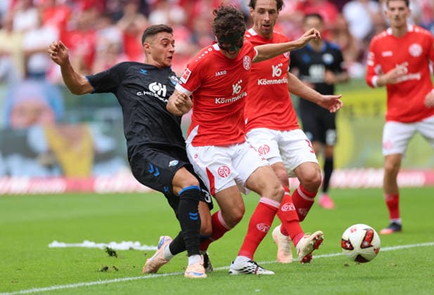 29.08.2026, Fussball Bundesliga, 1. FSV Mainz 05 - SC Paderborn, v.l., Stefano Marino (SC Paderborn), Fabio Gruber (FSV Mainz 05) DFL DFB REGULATIONS PROHIBIT ANY USE OF PHOTOGRAPHS AS IMAGE SEQUENCES AND OR QUASI-VIDEO. xdcx *** August 29, 2026, Bundesliga, 1 FSV Mainz 05 vs. SC Paderborn, from left: Stefano Marino (SC Paderborn), Fabio Gruber, FSV Mainz 05. DFL and DFB regulations prohibit any use of photographs as image sequences and or quasi-video. xdcx Copyright: HMBxMedia Claus