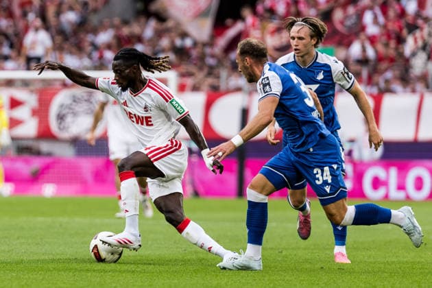 KOELN, GERMANY - AUGUST 29: Gideon Mensah (1. FC Koeln, 14) controls the ball against Vladimir Coufal (TSG 1899 Hoffenheim, 34) during the Bundesliga match between 1. FC Koeln vs. TSG 1899 Hoffenheim at Rheinenergie-Stadion on matchday 1 of the 1. Bundesliga on August 29, 2026 in Koeln, Germany. DFL REGULATIONS PROHIBIT ANY USE OF PHOTOGRAPHS AS IMAGE SEQUENCES AND OR QUASI-VIDEO. North Rhine Westphalia Germany Copyright: xSteffiexWunderlx