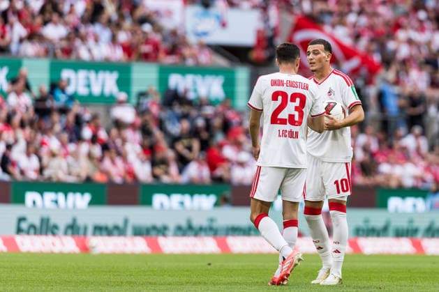 KOELN, GERMANY - AUGUST 29: Paul Okon-Engstler (1. FC Koeln, 23) and Said El Mala (1. FC Koeln, 10) discussing the next move during the Bundesliga match between 1. FC Koeln vs. TSG 1899 Hoffenheim at Rheinenergie-Stadion on matchday 1 of the 1. Bundesliga on August 29, 2026 in Koeln, Germany. DFL REGULATIONS PROHIBIT ANY USE OF PHOTOGRAPHS AS IMAGE SEQUENCES AND OR QUASI-VIDEO. North Rhine Westphalia Germany Copyright: xSteffiexWunderlx