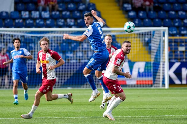 v.li.: Klaus Gjasula (TSG II, 5), Patrick Hobsch (Regensburg, 34), Zweikampf, Spielszene, Duell, duel, tackle, tackling, Dynamik, Action, Aktion, 29.08.2026, Sinsheim (Deutschland), Fussball, 3. Liga, TSG 1899 Hoffenheim II - SSV Jahn Regensburg, DFB DFL REGULATIONS PROHIBIT ANY USE OF PHOTOGRAPHS AS IMAGE SEQUENCES AND OR QUASI-VIDEO.