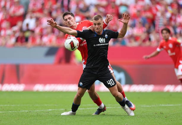 29.08.2026, Fussball Bundesliga, 1. FSV Mainz 05 - SC Paderborn, v.l., Anthony Caci (FSV Mainz 05), Gabriel Vidovic (SC Paderborn) DFL DFB REGULATIONS PROHIBIT ANY USE OF PHOTOGRAPHS AS IMAGE SEQUENCES AND OR QUASI-VIDEO. xdcx *** August 29, 2026, Bundesliga Soccer, 1. FSV Mainz 05 vs. SC Paderborn, from left: Anthony Caci (1. FSV Mainz 05), Gabriel Vidovic, SC Paderborn. DFL and DFB regulations prohibit any use of photographs as image sequences and or quasi-video. xdcx Copyright: HMBxMedia Claus