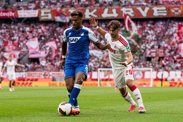 KOELN, GERMANY - AUGUST 29: Bambase Conte (TSG 1899 Hoffenheim, 20) controls the ball against Jan Thielmann (1. FC Koeln, 29) during the Bundesliga match between 1. FC Koeln vs. TSG 1899 Hoffenheim at Rheinenergie-Stadion on matchday 1 of the 1. Bundesliga on August 29, 2026 in Koeln, Germany. DFL REGULATIONS PROHIBIT ANY USE OF PHOTOGRAPHS AS IMAGE SEQUENCES AND OR QUASI-VIDEO. North Rhine Westphalia Germany Copyright: xSteffiexWunderlx