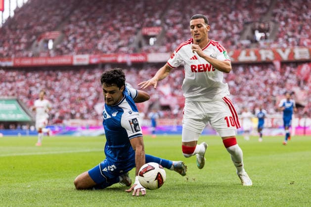 KOELN, GERMANY - AUGUST 29: Ozan Kabak (TSG 1899 Hoffenheim, 5) and Said El Mala (1. FC Koeln, 10) battle for the ball during the Bundesliga match between 1. FC Koeln vs. TSG 1899 Hoffenheim at Rheinenergie-Stadion on matchday 1 of the 1. Bundesliga on August 29, 2026 in Koeln, Germany. DFL REGULATIONS PROHIBIT ANY USE OF PHOTOGRAPHS AS IMAGE SEQUENCES AND OR QUASI-VIDEO. North Rhine Westphalia Germany Copyright: xSteffiexWunderlx