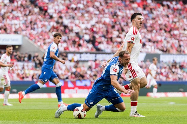 KOELN, GERMANY - AUGUST 29: Vladimir Coufal (TSG 1899 Hoffenheim, 34) and Luka Lochoshvili (1. FC Koeln, 24) battle for the ball during the Bundesliga match between 1. FC Koeln vs. TSG 1899 Hoffenheim at Rheinenergie-Stadion on matchday 1 of the 1. Bundesliga on August 29, 2026 in Koeln, Germany. DFL REGULATIONS PROHIBIT ANY USE OF PHOTOGRAPHS AS IMAGE SEQUENCES AND OR QUASI-VIDEO. North Rhine Westphalia Germany Copyright: xSteffiexWunderlx