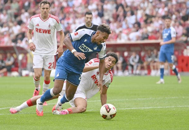Jahmai Simpson-Pusey r. (1. FC Köln) foult Bambase Conte (1899 Hoffenheim) es gibt Elfmeter, Foul, Aktion, Zweikampf. Fussball 1. Bundesliga, 1.Spieltag, 1. FC Koeln - TSG 1899 Hoffenheim, am 29.08.2026 in Koeln Deutschland. DFL regulations prohibit any use of photographs as image sequences and or quasi-video Â *** Jahmai Simpson Pusey of 1. FC Köln fouls Bambase Conte of 1899 Hoffenheim; penalty kick awarded, foul, play, tackle; Soccer, Bundesliga 1, Matchday 1, 1. FC Köln vs. TSG 1899 Hoffenheim, on August 29, 2026, in Cologne, Germany. DFL regulations prohibit any use of photographs as image sequences and or quasi-video. Â