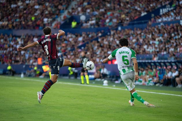 August 29, 2026, Valencia, Alicante, Spain: VALENCIA, SPAIN - AUGUST 29: 5 MARC BARTRA shoots the ball in front of 8 OLASAGASTI during the match between Levante UD and Real Betis, from LaLiga EASports, matchweek 3, disputed at the Ciutat de Valencia, Valencia Soccer 2026: Levante UD Vs Real Betis  - ZUMAc290 20260829_zsp_c290_042 Copyright: xJordixCantox