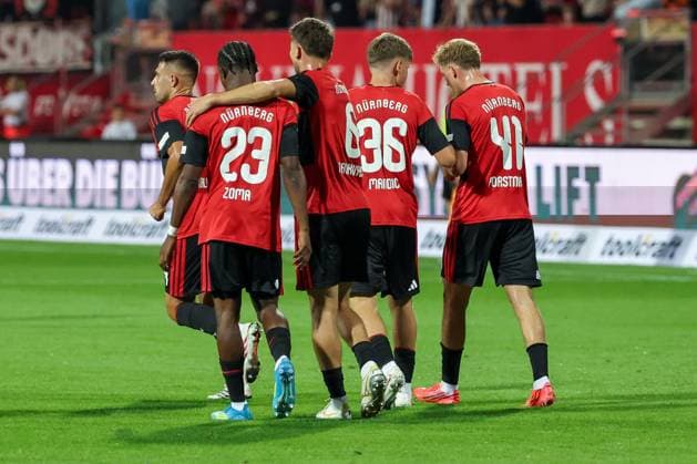 Mohamed Ali Zoma 23 (1FC Nuernberg) nach seinem Tor zum 1:0, Jubel, Freude, Emotion, mit Javier Fernandez 8 (1FC Nuernberg), und Eric Porstner 41 (1FC Nuernberg). 1. FC Nuernberg vs. DSC Arminia Bielefeld, Fussball, Maenner, 2. Bundesliga, Saison 2026 2027, Hinrunde, 3. Spieltag, 29.08.2026 DFB regulations prohibit any use of photographs as image sequences and or quasi-video Nuernberg Bayern Deutschland *** Mohamed Ali Zoma, 23, of 1. FC Nuremberg, after scoring the 1-0 goal, Celebration, joy, emotion, with Javier Fernandez (8), 1. FC Nuremberg, and Eric Porstner (41), 1. FC Nuremberg; 1. FC Nuremberg vs. DSC Arminia Bielefeld, soccer, men’s, 2. Bundesliga, 2026–2027 season, First Half of the Season, Matchday 3, August 29, 2026. DFB regulations prohibit any use of photographs as image sequences and or quasi-video. Nuremberg, Bavaria, Germany Copyright: xkolbert-press MartinxAgüerax