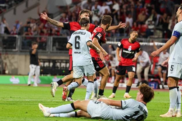 Adam Markhiyev 6 (1FC Nuernberg) jubelt ueber seinen zweiten Treffer am Abend zum 4:0, mit Javier Fernandez 8 (1FC Nuernberg)., die Arminia am Boden, mit Maximilian Grosser 19 (DSC Arminia Bielefeld),, 1. FC Nuernberg vs. DSC Arminia Bielefeld, Fussball, Maenner, 2. Bundesliga, Saison 2026 2027, Hinrunde, 3. Spieltag, 29.08.2026 DFB regulations prohibit any use of photographs as image sequences and or quasi-video Nuernberg Bayern Deutschland *** Adam Markhiyev (6, 1. FC Nuremberg) celebrates his second goal of the night to make it 4–0, alongside Javier Fernandez (8, 1. FC Nuremberg), with Arminia down and out, alongside Maximilian Grosser (19, DSC Arminia Bielefeld), 1 FC Nuremberg vs. DSC Arminia Bielefeld, Soccer, Men, 2. Bundesliga, 2026–2027 season, First Half of the Season, Matchday 3, August 29, 2026. DFB regulations prohibit any use of photographs as image sequences and or quasi-video. Nuremberg, Bavaria, Germany Copyright: xkolbert-press MartinxAgüerax