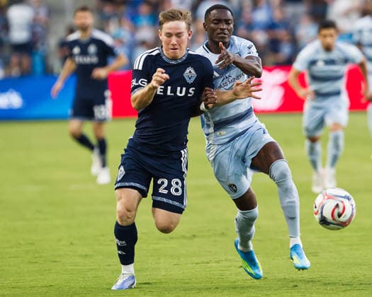 August 29, 2026, Kansas City, Kansas, USA: Vancouver Whitecaps FC defender TATE JOHNSON 28 (l) is on the defense against Sporting KC forward CAPITA CAPEMBA 7 (r) during the second half of the game at Sporting Park in Kansas City, KS, on August 29, 2026. Kansas City USA - ZUMAh139 20260829_zap_h139_001 Copyright: xSerenaxS.Y.xHsux