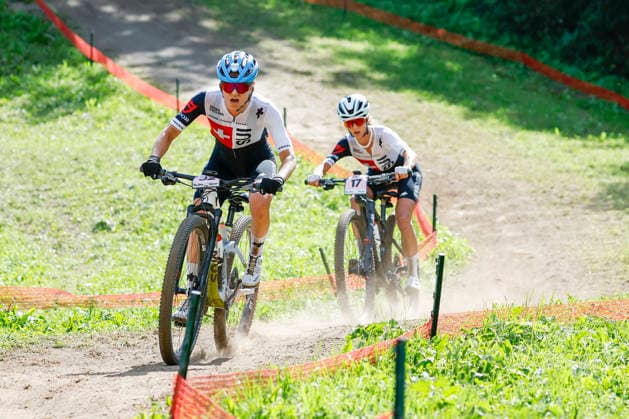 TRENTO, ITALY - AUGUST 30: Ginia Caluori from Switzerland L) chased by Jolanda Neff from Switzerland R) during the Uci Mountainbike World Championship, WM, Weltmeisterschaft - Women Elite Cross-County World Championships at Val di Sole on August 30, 2026 in Trento, Italy. Trento Val di Sole Trento Italy Copyright: xJustPictures.ch FrancescoxMinghettix jp-en-EuSpIm-JP6_FRM_UCIWC_GRLXCO_30Aug_000225