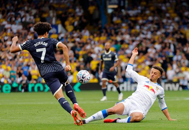 Leeds, England, 30th August 2026. Kevin Schade of Brentford tackled by Ethan Ampadu of Leeds United during the Leeds United vs Brentford Premier League match at Elland Road, Leeds. Picture credit should read: James Baylis Sportimage EDITORIAL USE ONLY. No use with unauthorised audio, video, data, fixture lists, club league logos or live services. Online in-match use limited to 120 images, no video emulation. No use in betting, games or single club league player publications. SPI_011_JB_Leeds_Brentford SPI-4950-0011