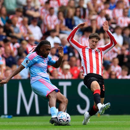 Sunderland v Fulham Premier League Calvin Bassey of Fulham passes under pressure from Trai Hume of Sunderland (right) during the Premier League match at the Stadium of Light, Sunderland 30 08 2026 UK Newspapers OUT Copyright: xFredxPalmerx FIL-23863-0038