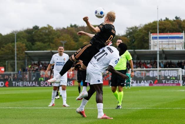 VELSEN-ZUID , 30-08-2026 , BUKO Stadion , season 2026 2027 , Dutch Eredivisie football , match between Telstar and Ajax , Picture shows Ajax player Julian Brandt, Telstar player Tyrone Owusu Telstar - Ajax  x206249006x Copyright: