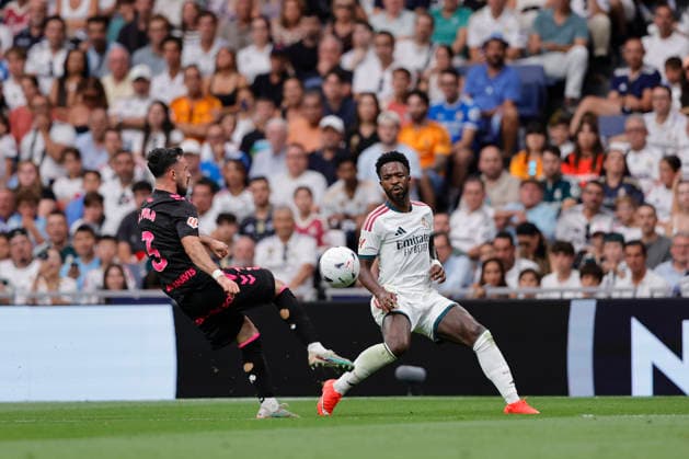 RECORD DATE NOT STATED Vinicius Jr (Real Madrid CF) and Carlos Puga (Malaga CF) battle for the ball during the LaLiga EA Sports match between Real Madrid CF and Malaga CF at Estadio Santiago BernabÃ u on August 30, 2026 in Madrid, Spain. (Photo by Manu Reino DeFodi Images) -